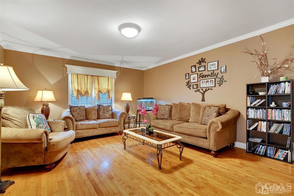 83 Amboy Road Old Bridge, NJ 07747 - Photo 12 of 40 a living room with furniture and a wooden floor
