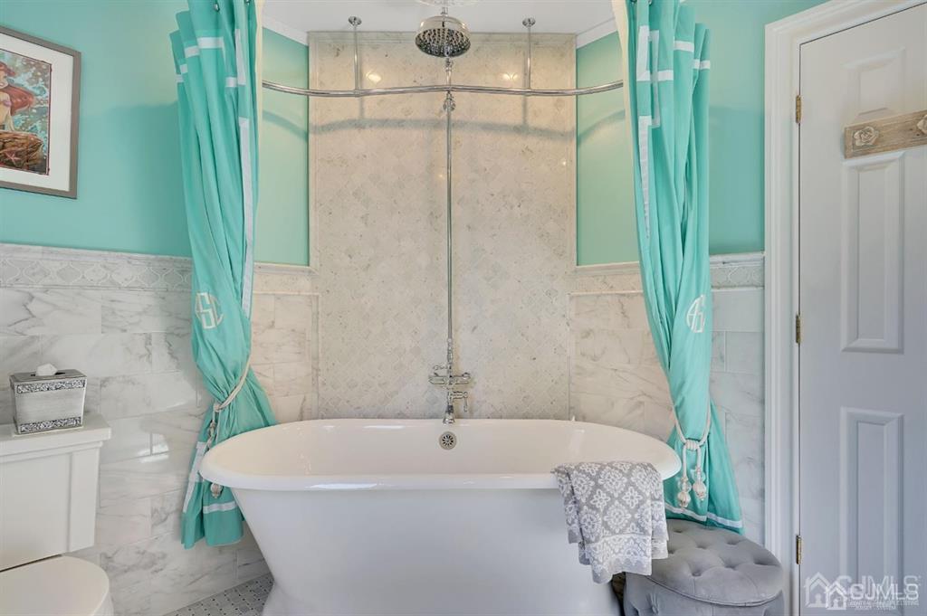 83 Amboy Road Old Bridge, NJ 07747 - Photo 17 of 40 a white bath tub sitting next to a white toilet