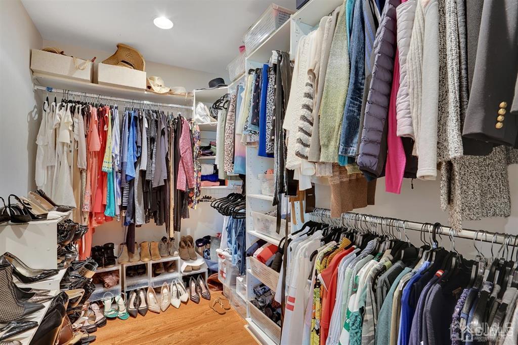 83 Amboy Road Old Bridge, NJ 07747 - Photo 23 of 40 a view of walk in closet with clothes