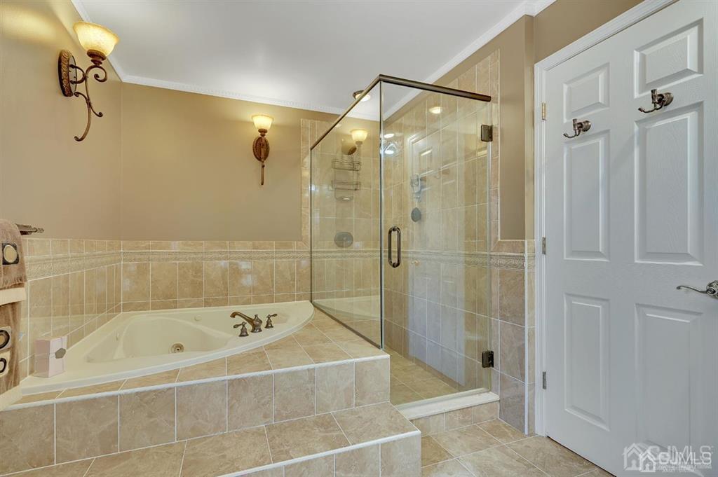 83 Amboy Road Old Bridge, NJ 07747 - Photo 26 of 40 a bathroom with a bathtub and shower