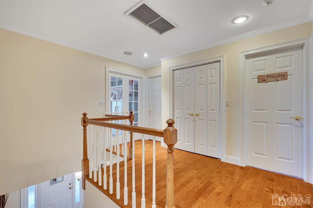 83 Amboy Road Old Bridge, NJ 07747 - Photo 29 of 40 a view of a hallway with wooden floor and windows
