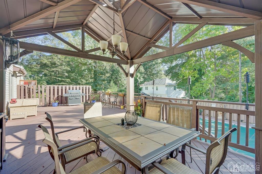 83 Amboy Road Old Bridge, NJ 07747 - Photo 33 of 40 a view of a patio with a table chairs and a table