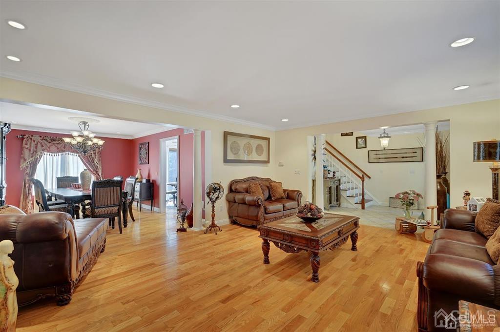 83 Amboy Road Old Bridge, NJ 07747 - Photo 4 of 40 a living room with furniture and wooden floor