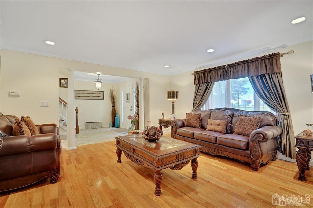 83 Amboy Road Old Bridge, NJ 07747 - Photo 5 of 40 a living room with furniture and a wooden floor