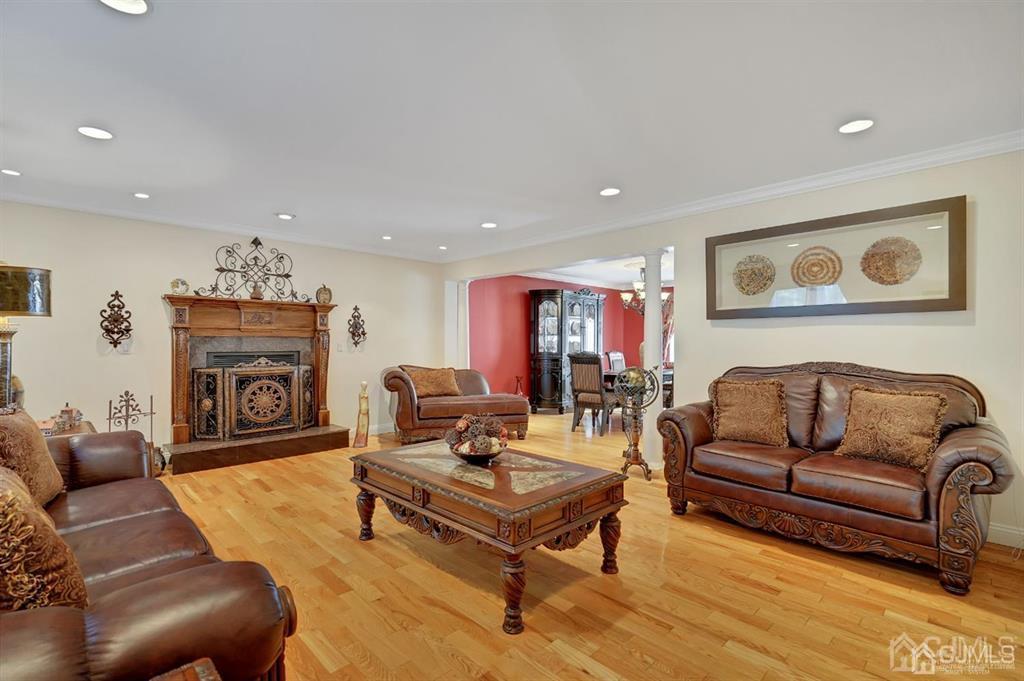 83 Amboy Road Old Bridge, NJ 07747 - Photo 6 of 40 a living room with furniture and a fireplace