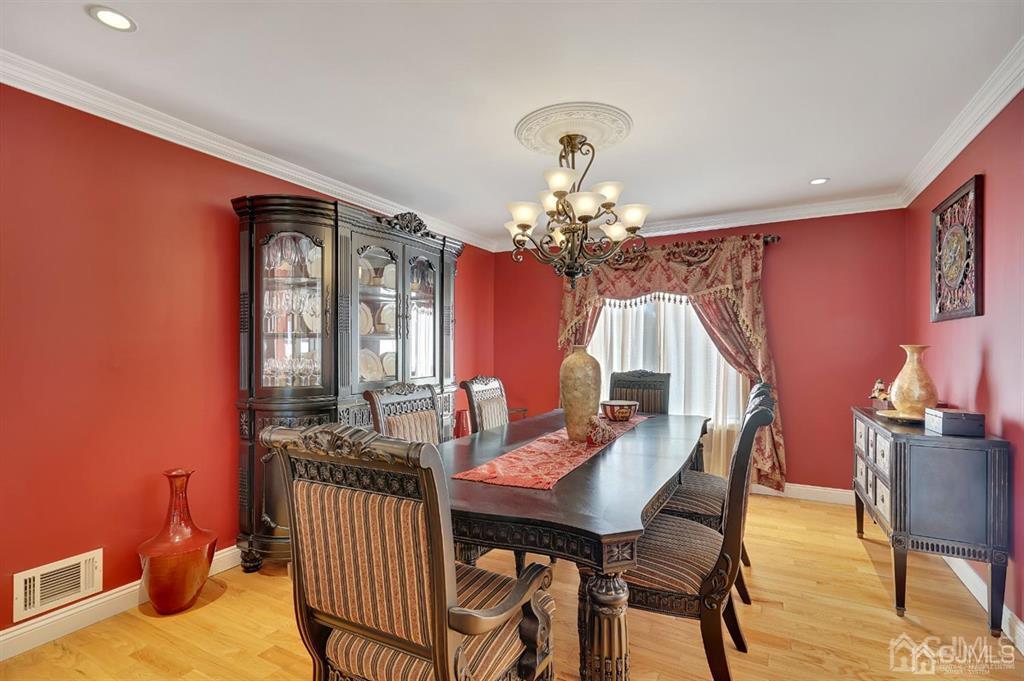 83 Amboy Road Old Bridge, NJ 07747 - Photo 8 of 40 a view of a dining room with furniture and chandelier
