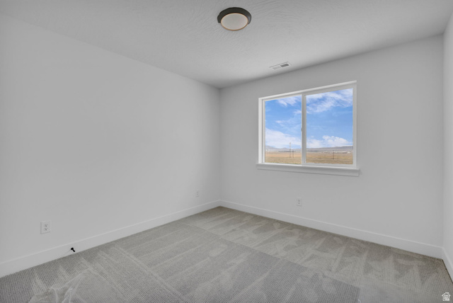2821 Scarlet Road, Unit 149 Eagle Mountain, UT 84005 - Photo 14 of 28 Bright bedroom and a large window offering expansive outdoor scenery.
