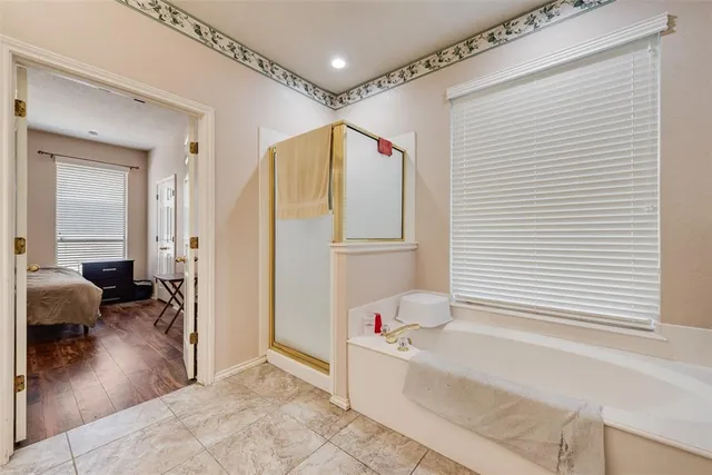 a very nice looking room with wooden floor and furniture