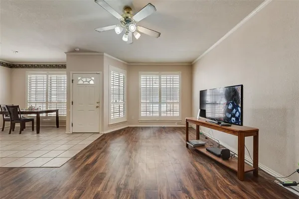 a view of a livingroom with furniture and a flat screen tv
