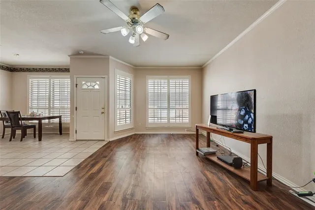 a view of a livingroom with furniture and a flat screen tv