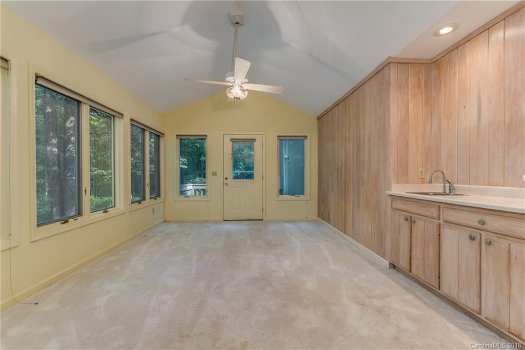 688 Laurel Ridge Road Columbus, NC 28722 - Photo 11 of 30 a view of an empty room with a window