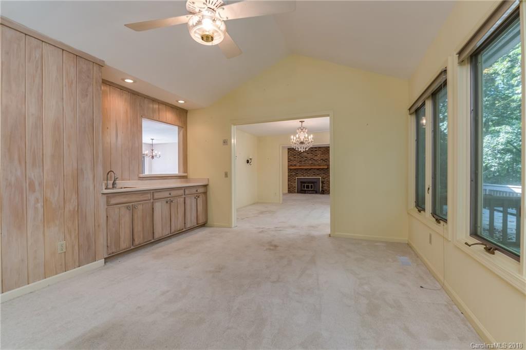 688 Laurel Ridge Road Columbus, NC 28722 - Photo 12 of 30 a view of a kitchen with a sink and a large window