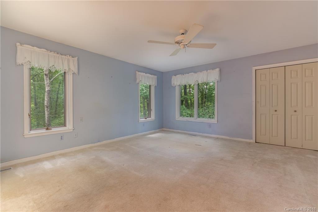 688 Laurel Ridge Road Columbus, NC 28722 - Photo 13 of 30 a view of an empty room with a window