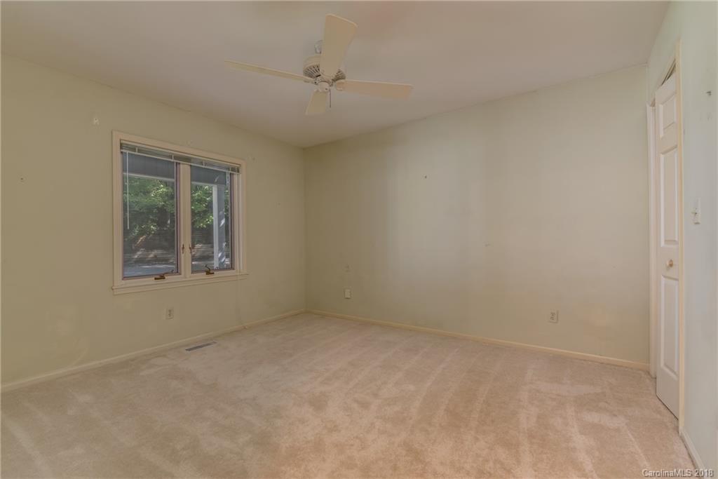688 Laurel Ridge Road Columbus, NC 28722 - Photo 15 of 30 an empty room with a window