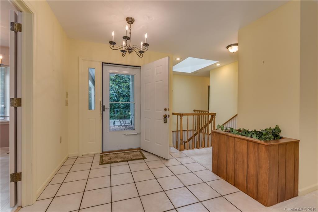 688 Laurel Ridge Road Columbus, NC 28722 - Photo 3 of 30 a view of an entryway with a chandelier