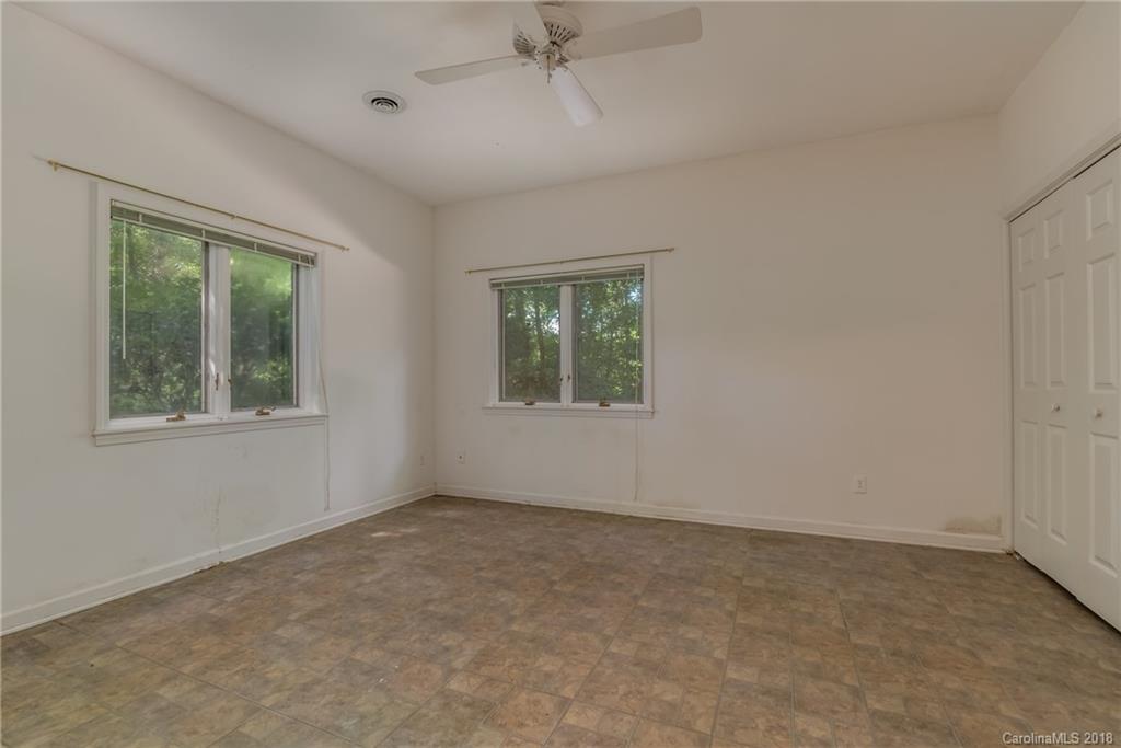 688 Laurel Ridge Road Columbus, NC 28722 - Photo 24 of 30 an empty room with windows