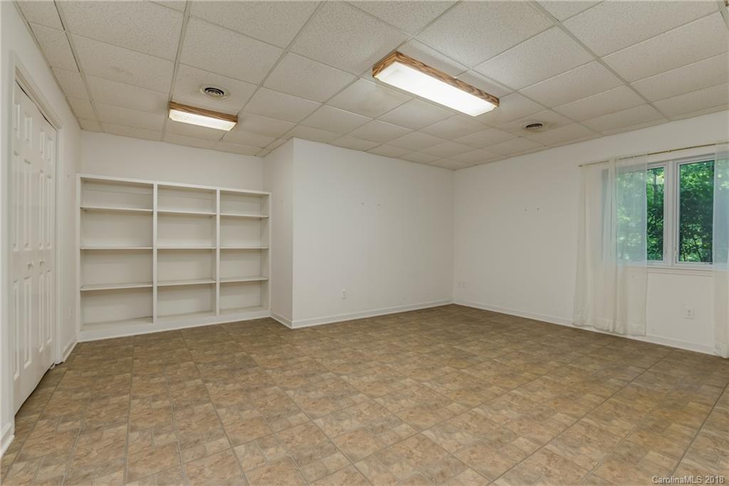 688 Laurel Ridge Road Columbus, NC 28722 - Photo 26 of 30 wooden floor in an empty room with a window