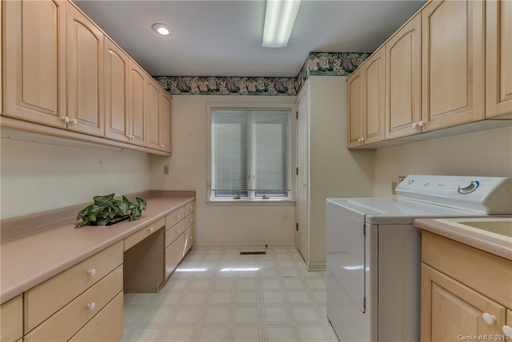 688 Laurel Ridge Road Columbus, NC 28722 - Photo 27 of 30 a kitchen with a sink and cabinets