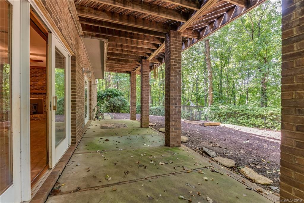 688 Laurel Ridge Road Columbus, NC 28722 - Photo 28 of 30 a view of a porch with hardwood