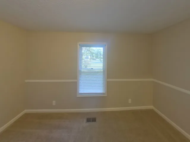 a bathroom with a toilet and a bathtub