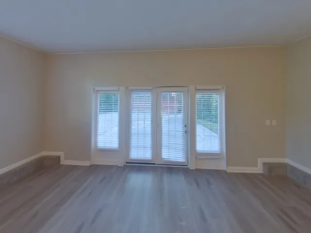 a view of a deck with a table and a chair