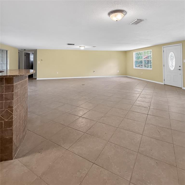 17220 Estes Road Lutz, FL 33548 - Photo 6 of 25 a view of an empty room with a window
