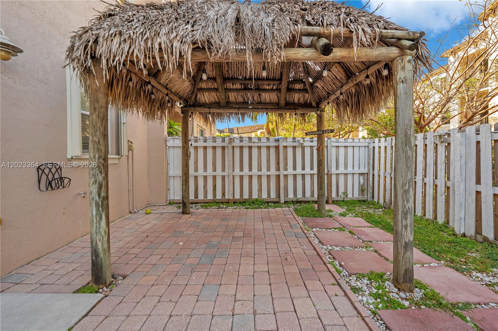 27433 Southwest 137th Court, Unit 1 Homestead, FL 33032 - Photo 23 of 28 a view of a pathway with a white house