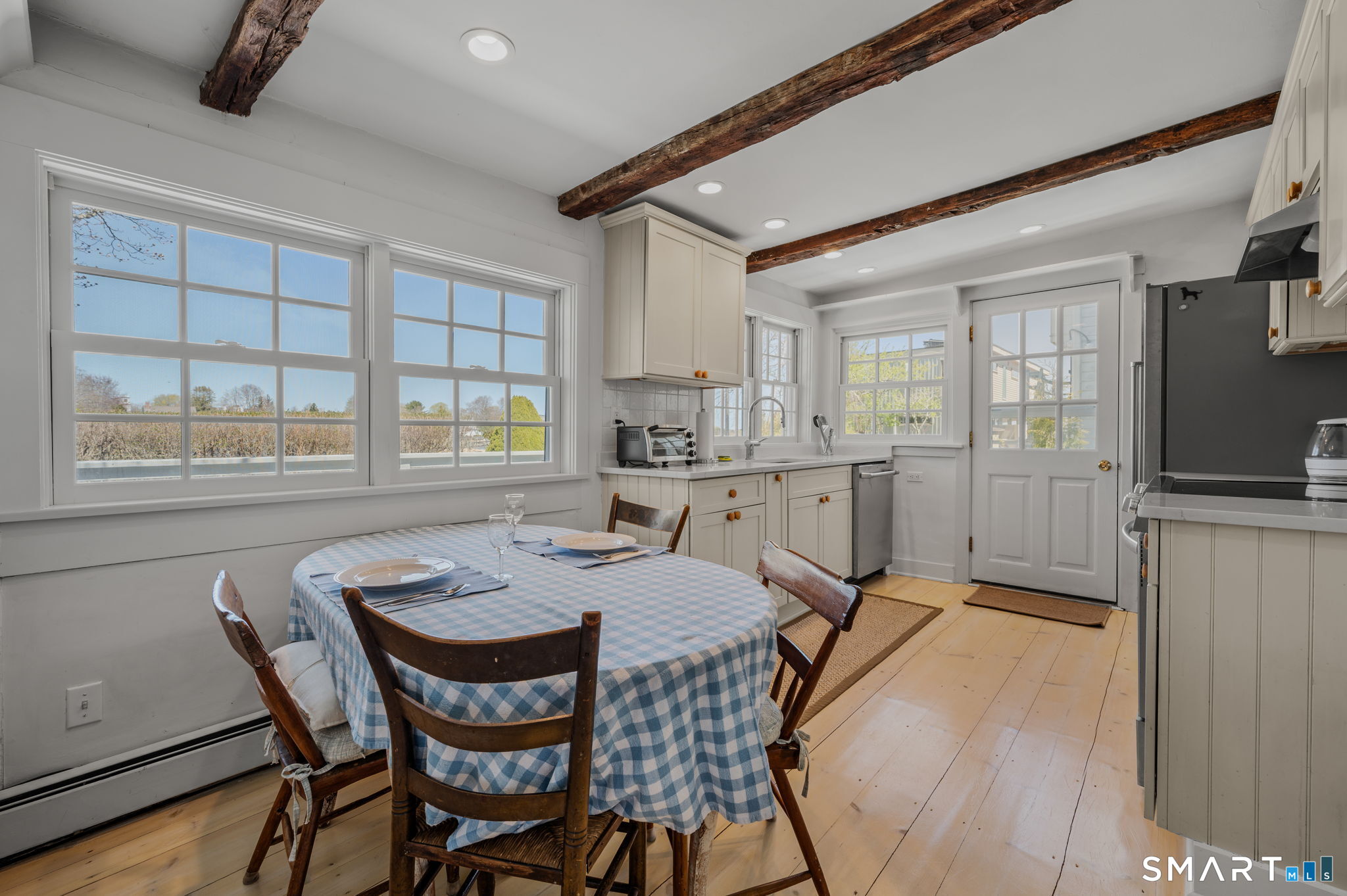 20 Diving Street Stonington, CT 06378 - Photo 12 of 33 a view of a dining room with furniture window and outside view