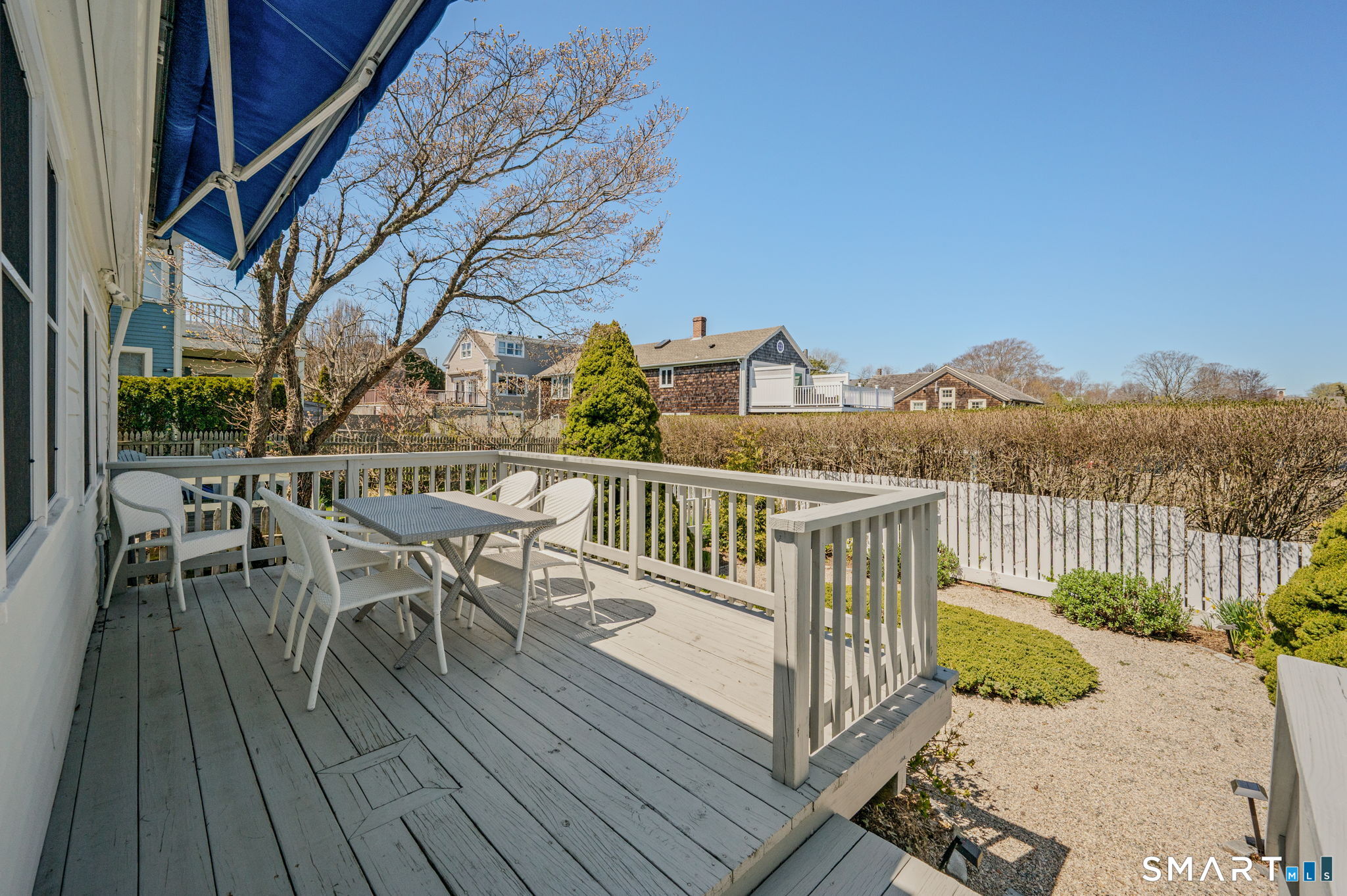 20 Diving Street Stonington, CT 06378 - Photo 15 of 33 a view of a roof deck with table and chairs