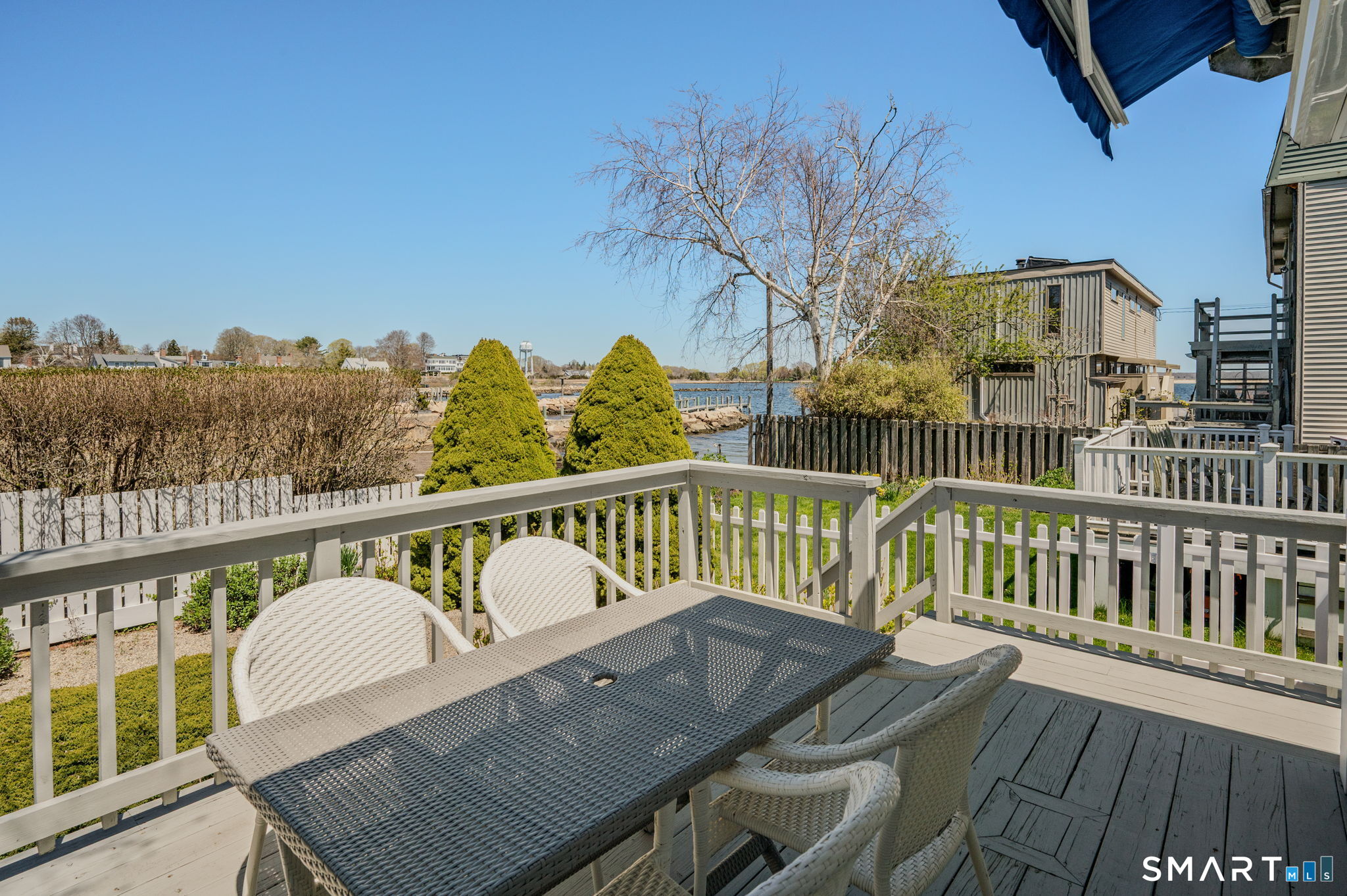 20 Diving Street Stonington, CT 06378 - Photo 17 of 33 a view of a balcony with wooden floor and outdoor seating