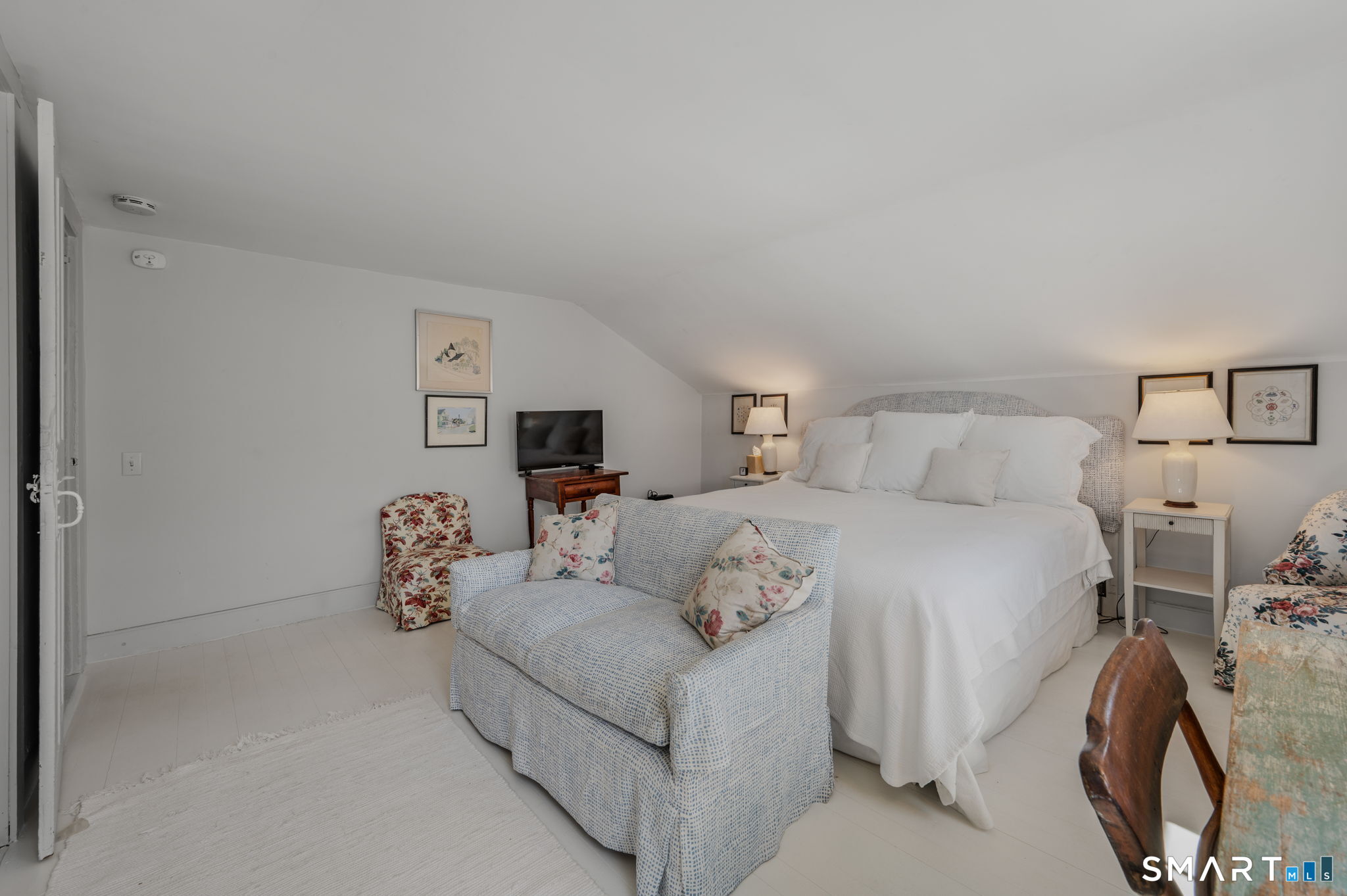 20 Diving Street Stonington, CT 06378 - Photo 19 of 33 a bedroom with a bed and a couch