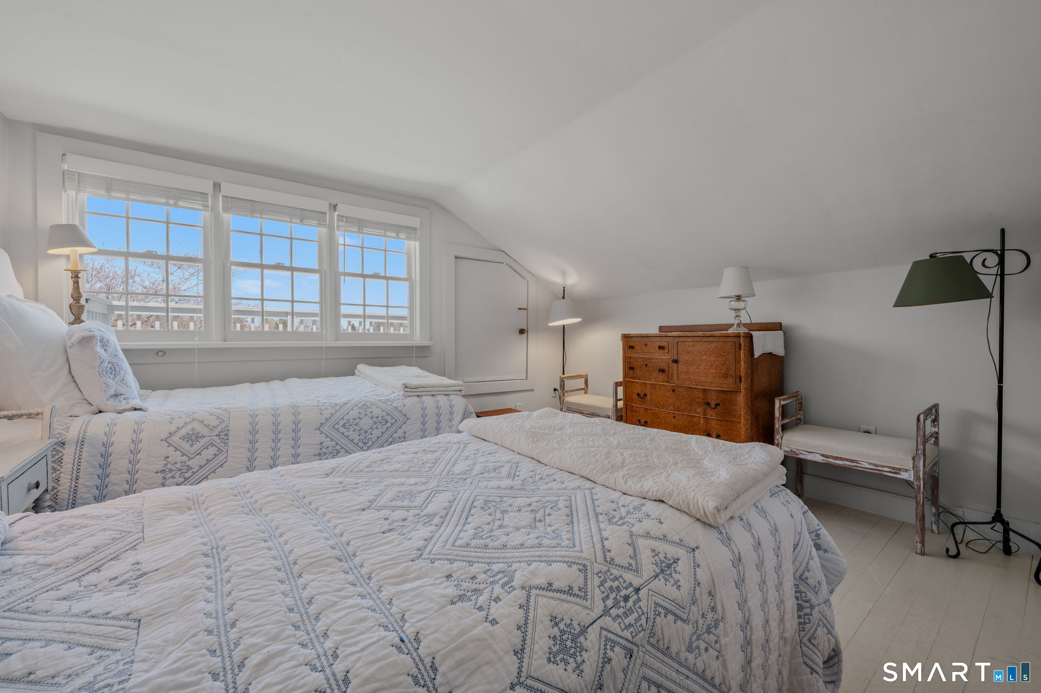 20 Diving Street Stonington, CT 06378 - Photo 21 of 33 a bedroom with a bed and wooden floor