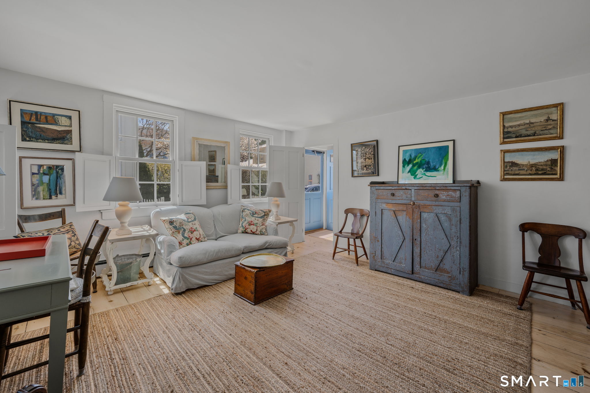 20 Diving Street Stonington, CT 06378 - Photo 4 of 33 a living room with furniture and a wooden floor