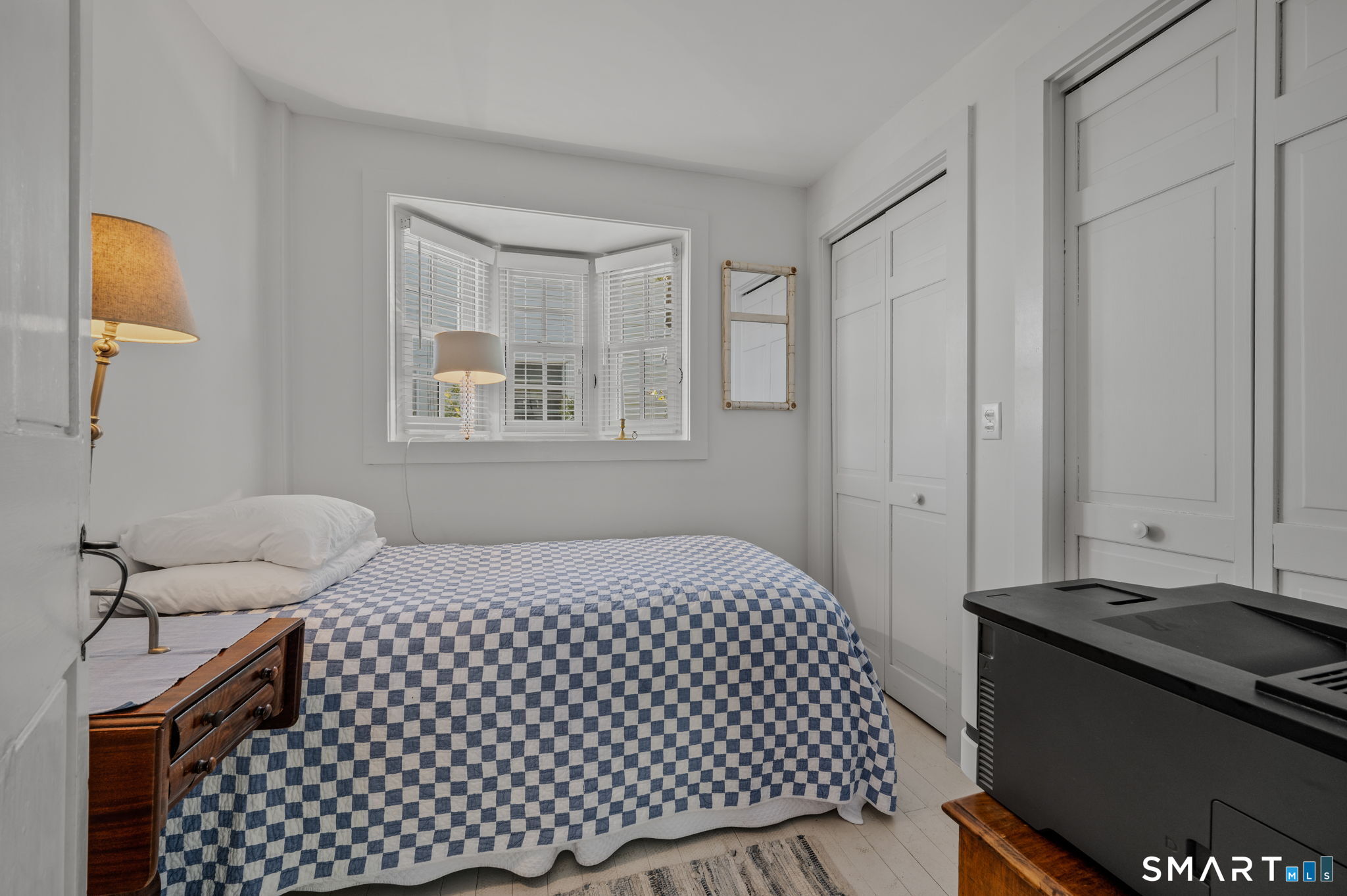 20 Diving Street Stonington, CT 06378 - Photo 8 of 33 a bedroom with a bed and a window