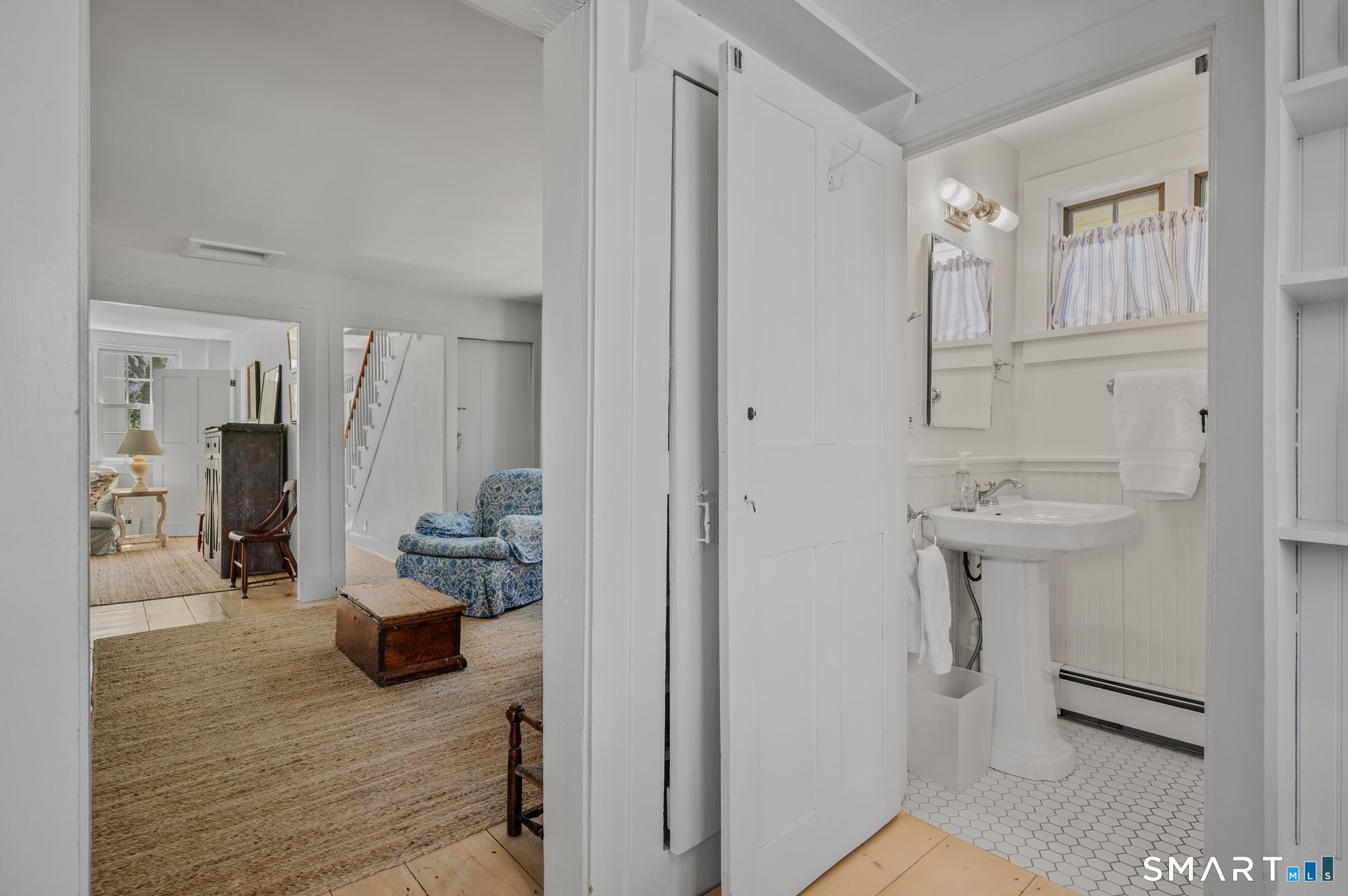 20 Diving Street Stonington, CT 06378 - Photo 9 of 33 a bathroom with a sink and a mirror