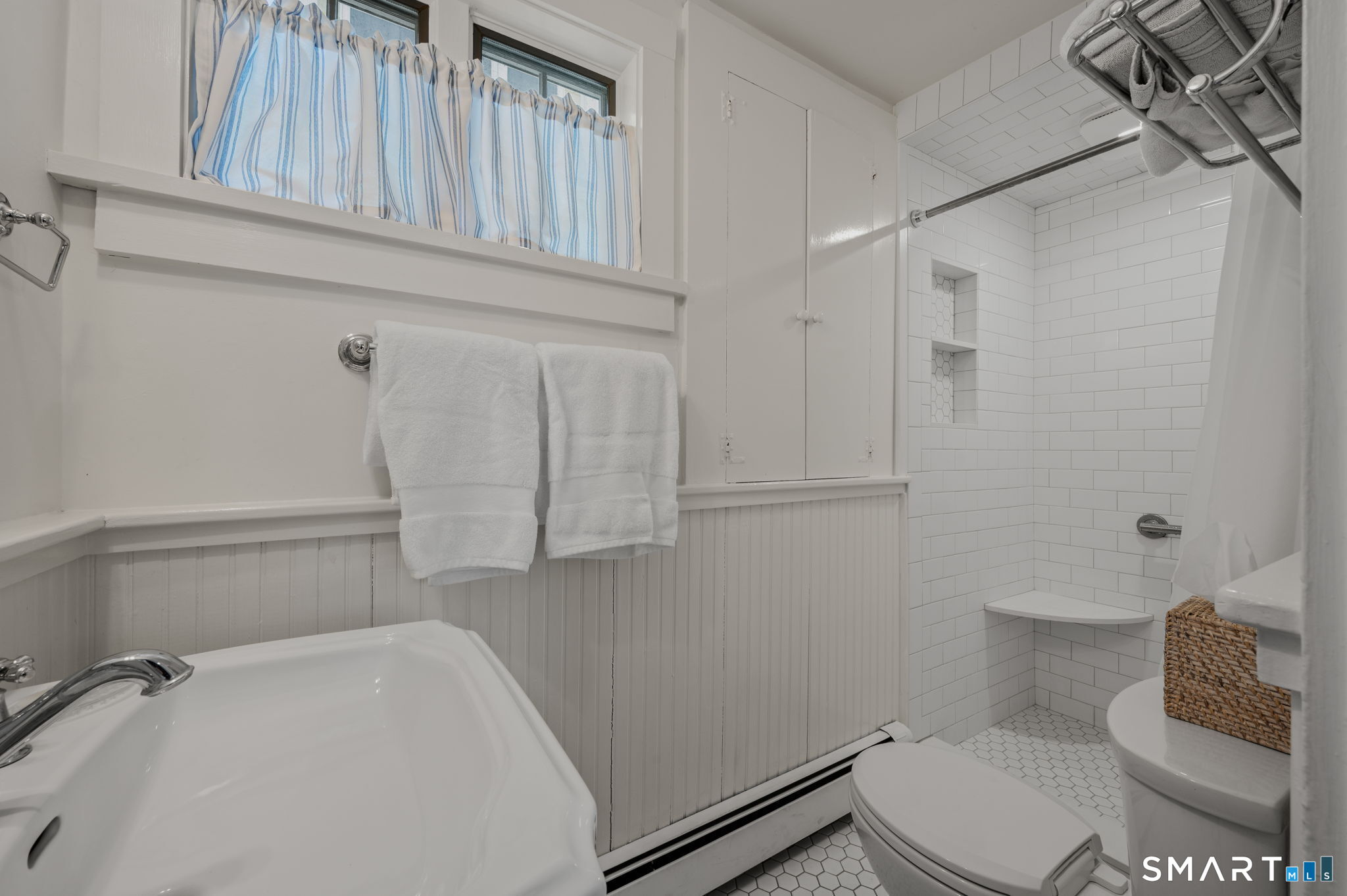 20 Diving Street Stonington, CT 06378 - Photo 10 of 33 a bathroom with a toilet and a shower