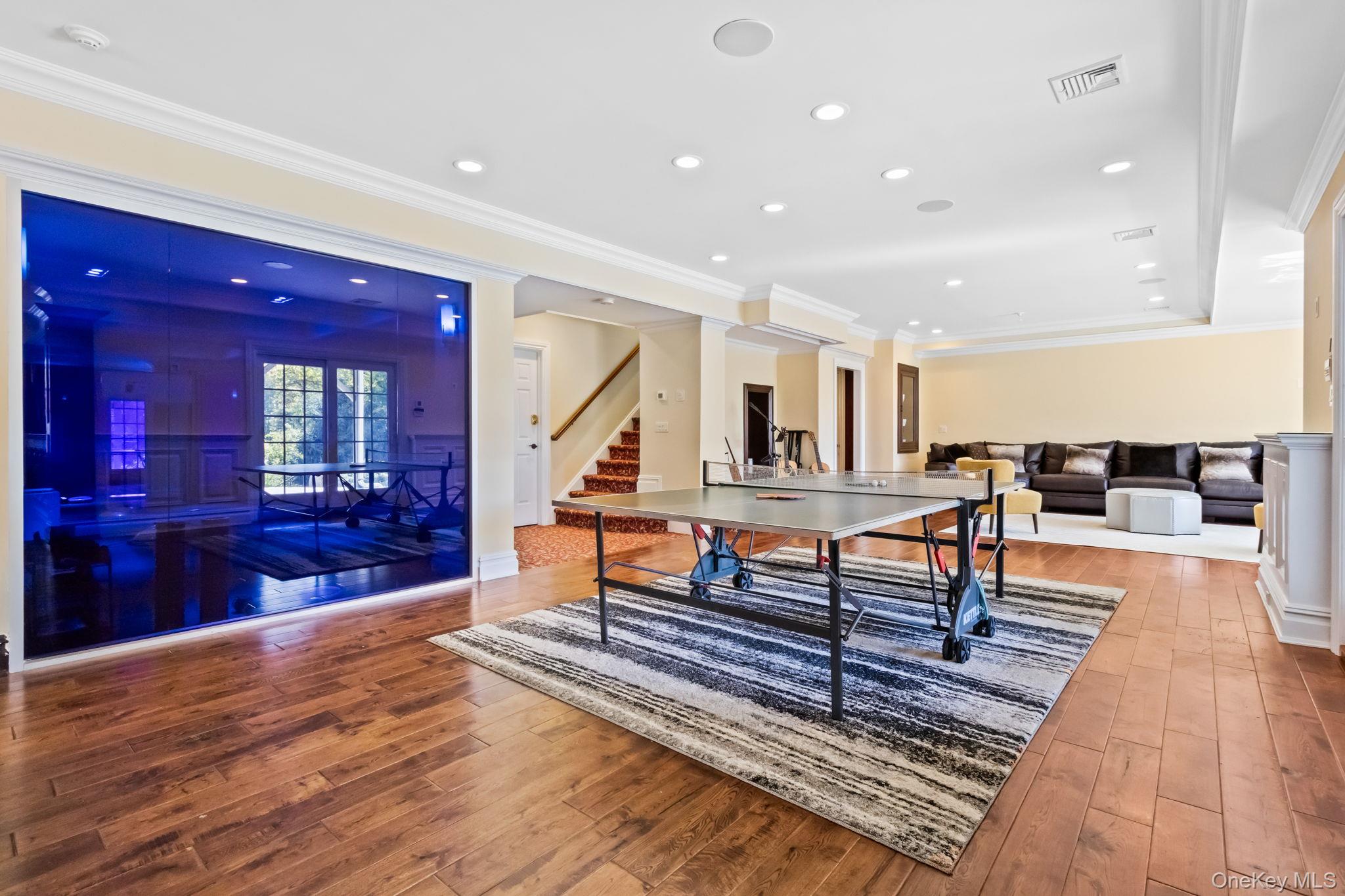 496 Long Ridge Road Bedford, NY 10576 - Photo 35 of 49 Recreation room with crown molding, hardwood / wood-style floors, and recessed lighting