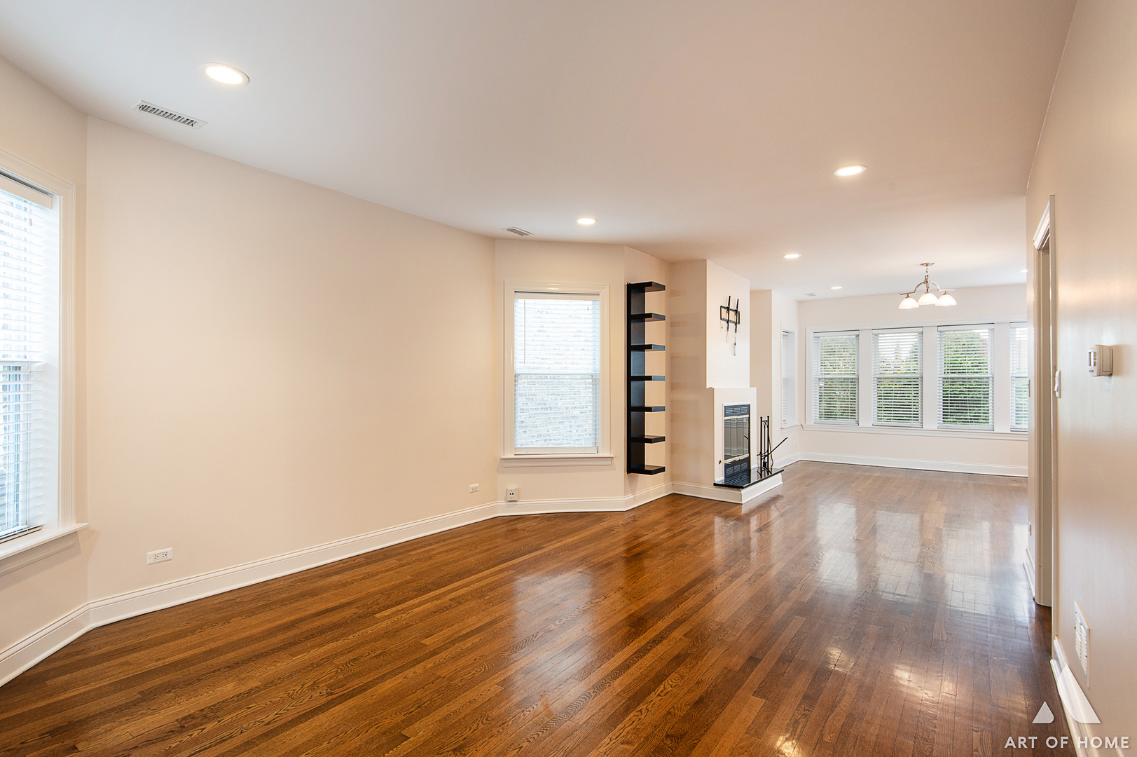 4820 West George Street, Unit 2 Chicago, IL 60641 - Photo 17 of 24 a view of an empty room with wooden floor and a window