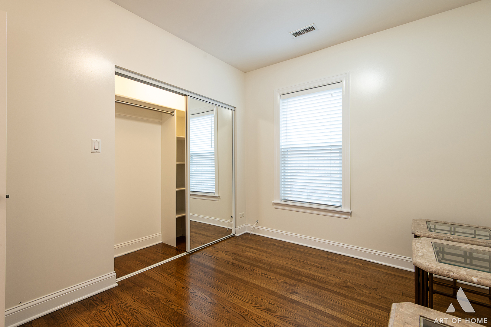 4820 West George Street, Unit 2 Chicago, IL 60641 - Photo 18 of 24 an empty room with wooden floor and windows