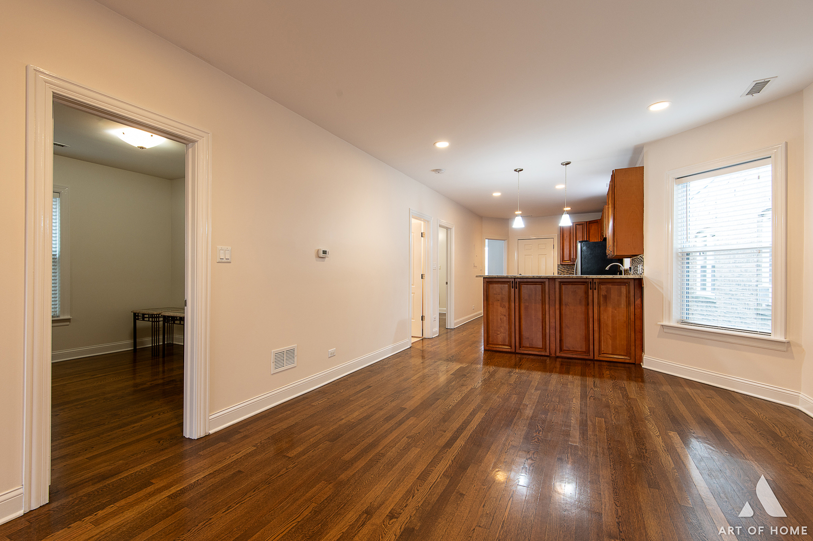 4820 West George Street, Unit 2 Chicago, IL 60641 - Photo 20 of 24 a view of an empty room with wooden floor and a window