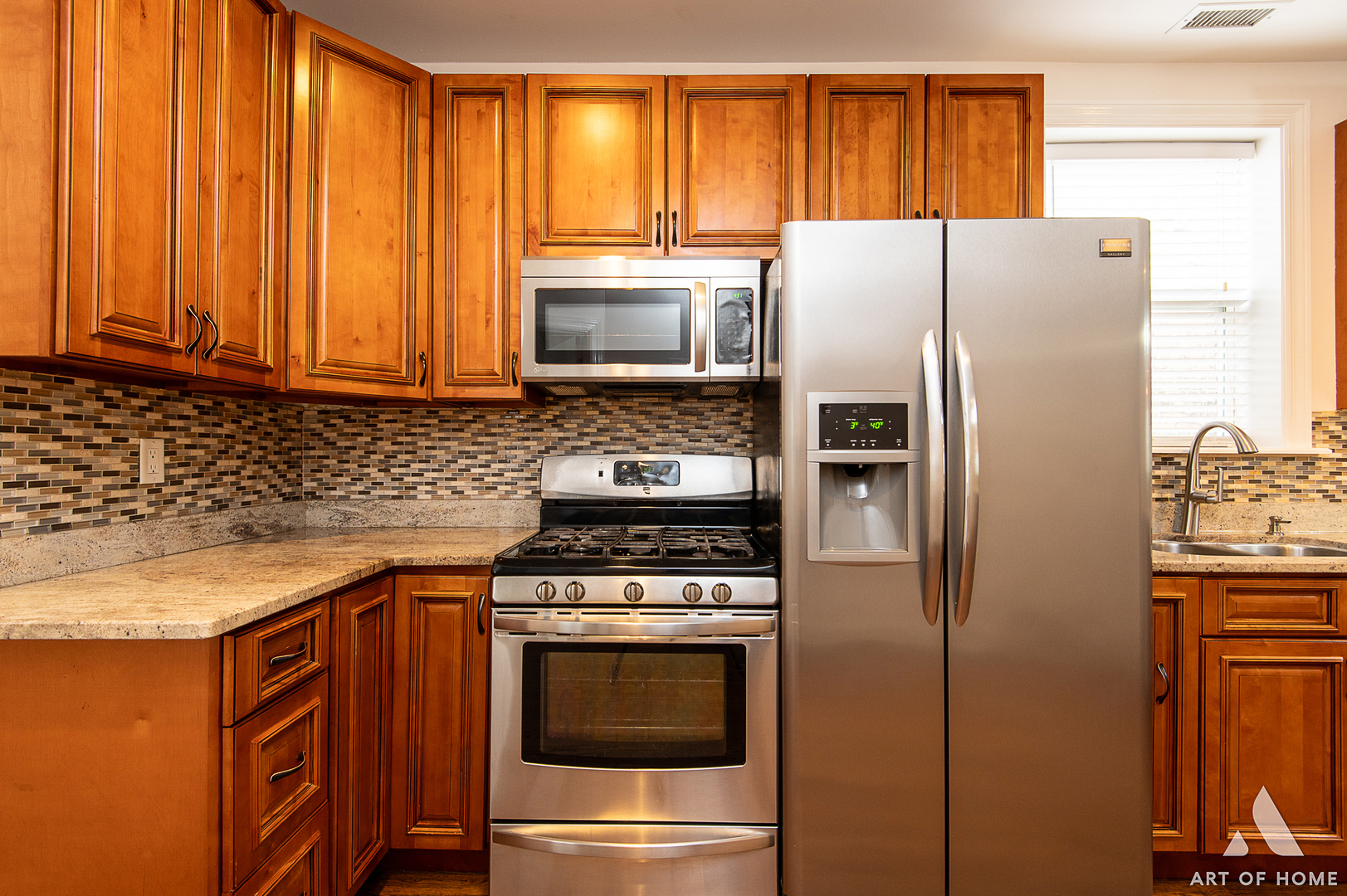 4820 West George Street, Unit 2 Chicago, IL 60641 - Photo 3 of 24 a kitchen with granite countertop a refrigerator stove and microwave