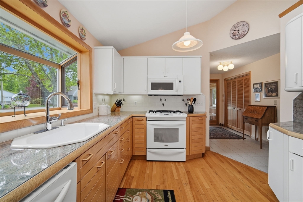 30 Birch Hill Road Northampton, MA 01062 - Photo 10 of 42 a kitchen with stainless steel appliances granite countertop a sink a stove and a refrigerator