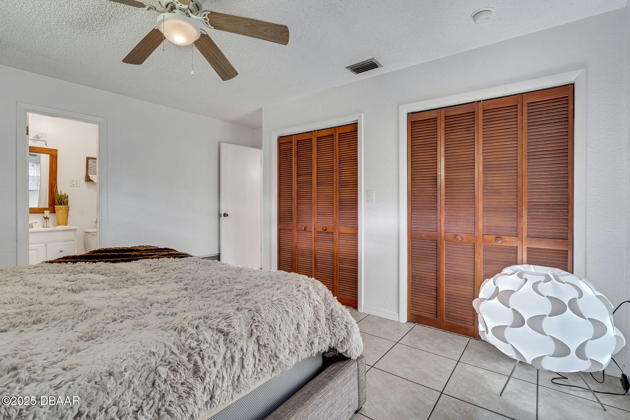 2439 Old Samsula Road Port Orange, FL 32128 - Photo 20 of 35 a bedroom with a bed and window