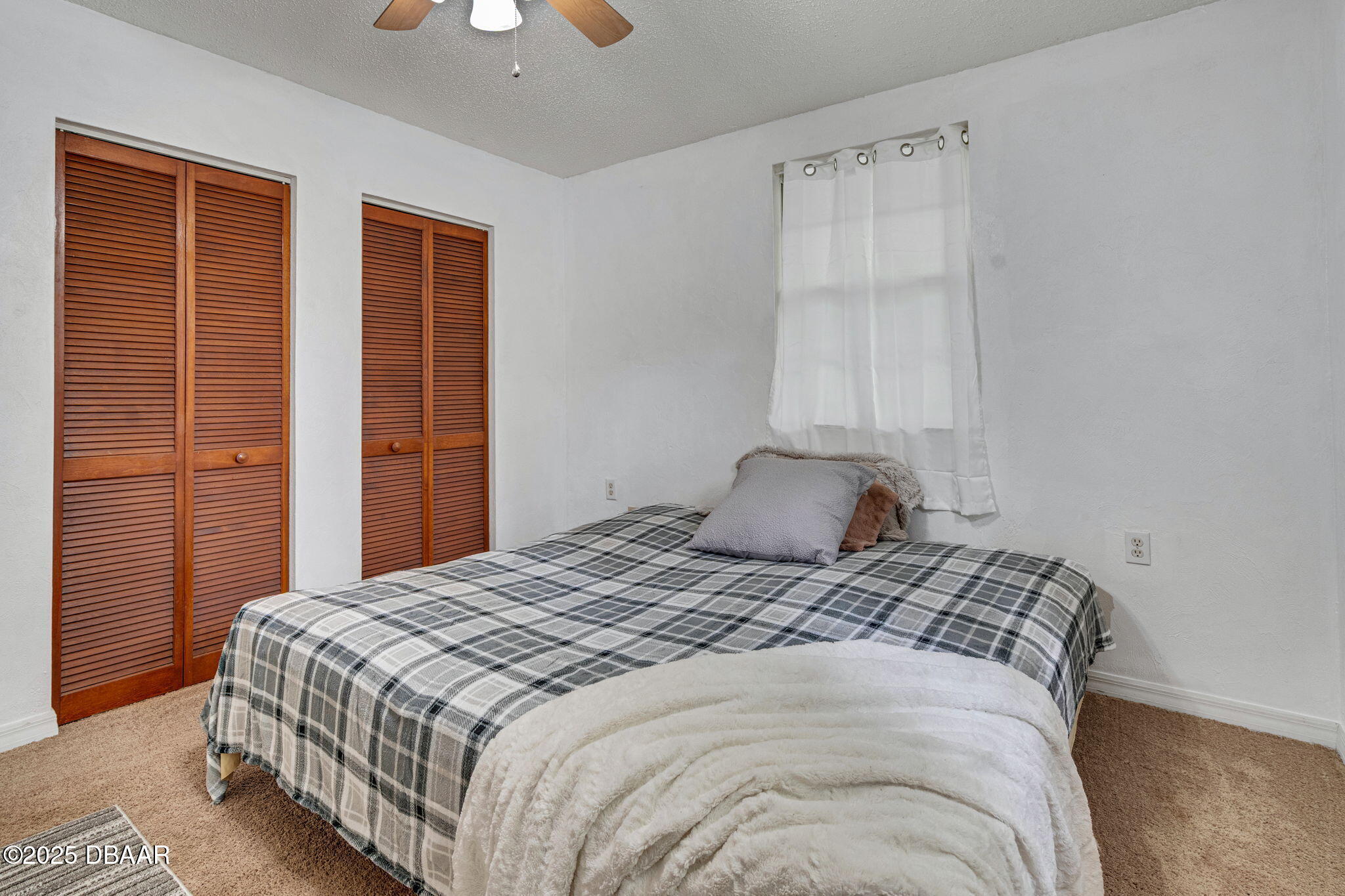 2439 Old Samsula Road Port Orange, FL 32128 - Photo 22 of 35 a bedroom with a bed and a window