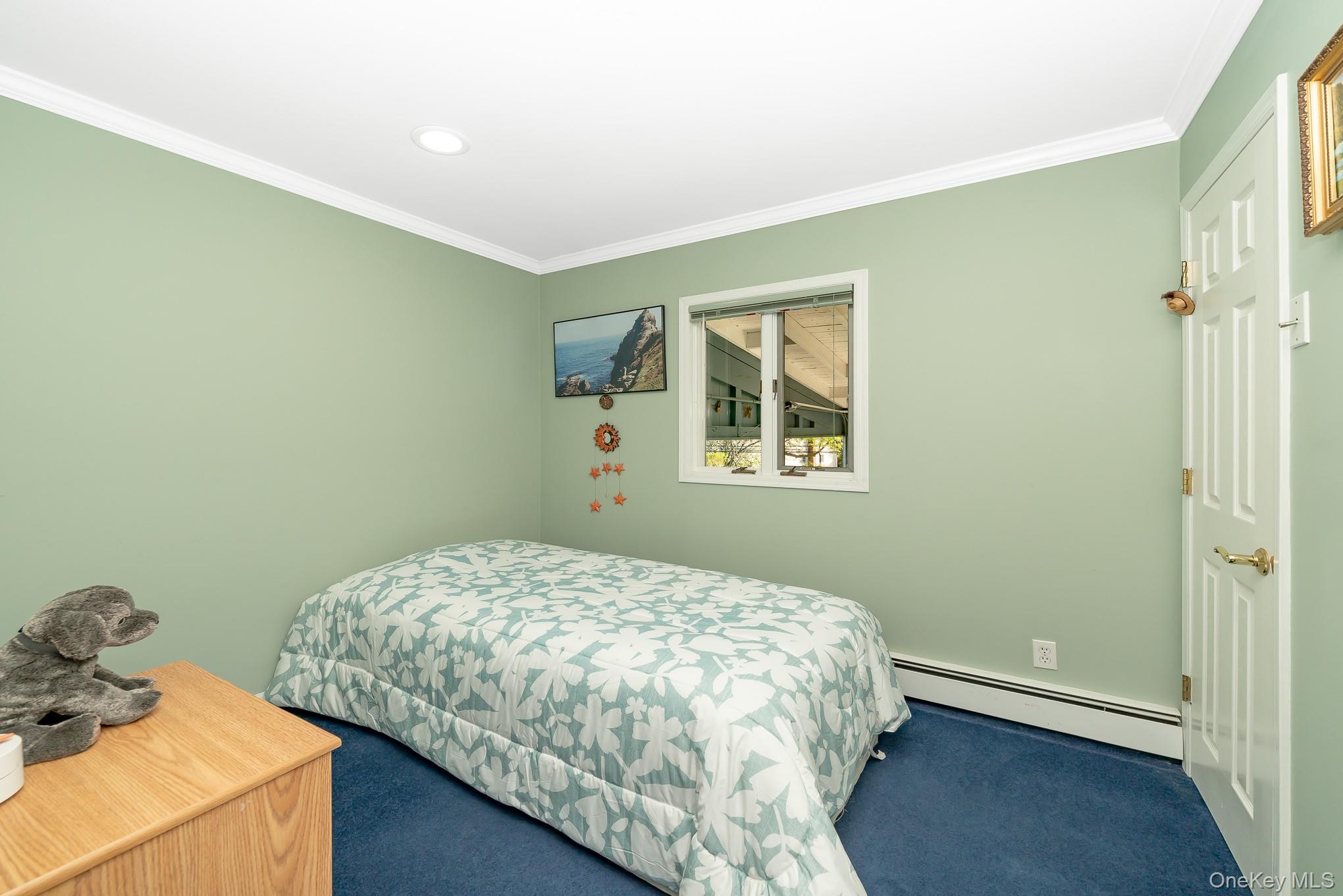 18 Byron Road Commack, NY 11725 - Photo 20 of 32 Bedroom featuring a single window, recessed lighting, crown molding, and baseboard heating