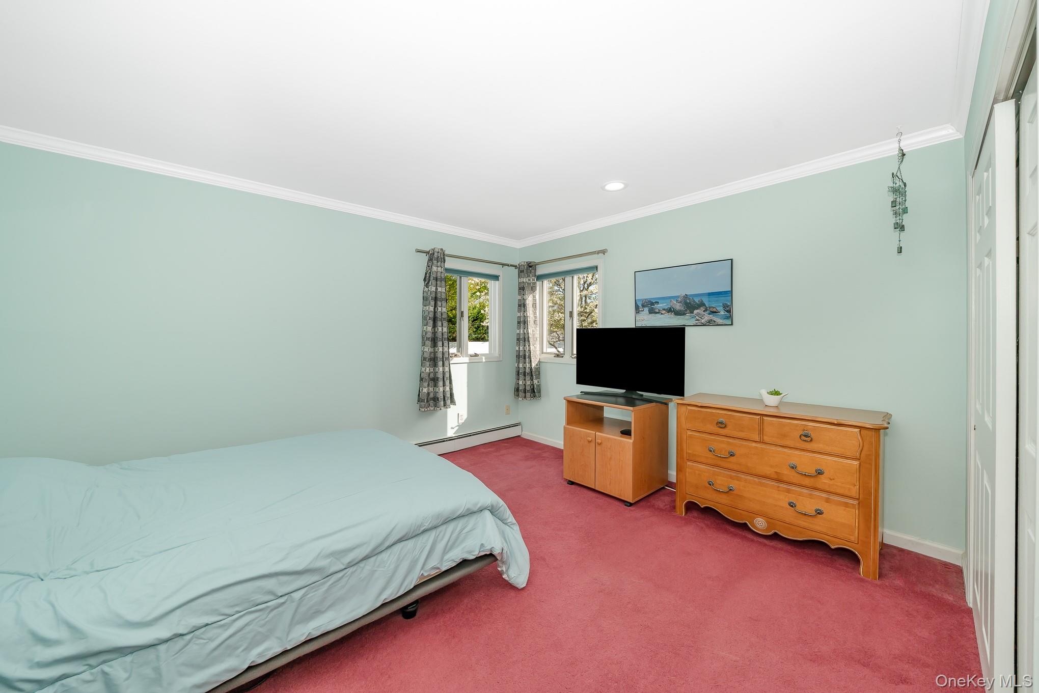 18 Byron Road Commack, NY 11725 - Photo 21 of 32 Bedroom featuring two windows, recessed lighting, crown molding, and red carpeting