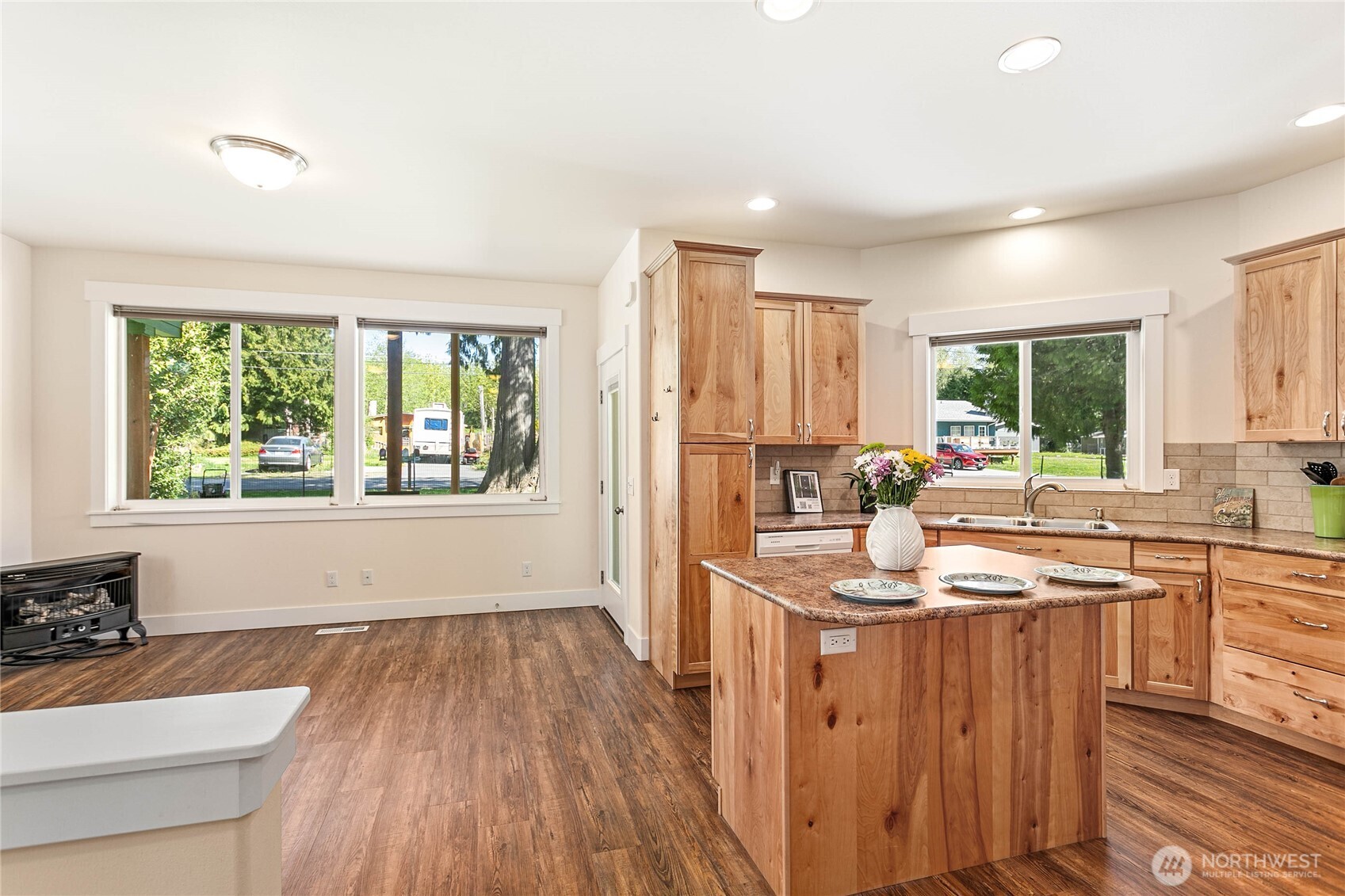 4597 Orcas Way Ferndale, WA 98248 - Photo 13 of 40 a kitchen with wooden floors and sink