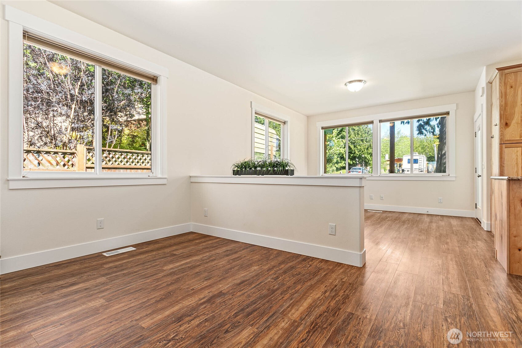 4597 Orcas Way Ferndale, WA 98248 - Photo 15 of 40 an empty room with wooden floor and windows