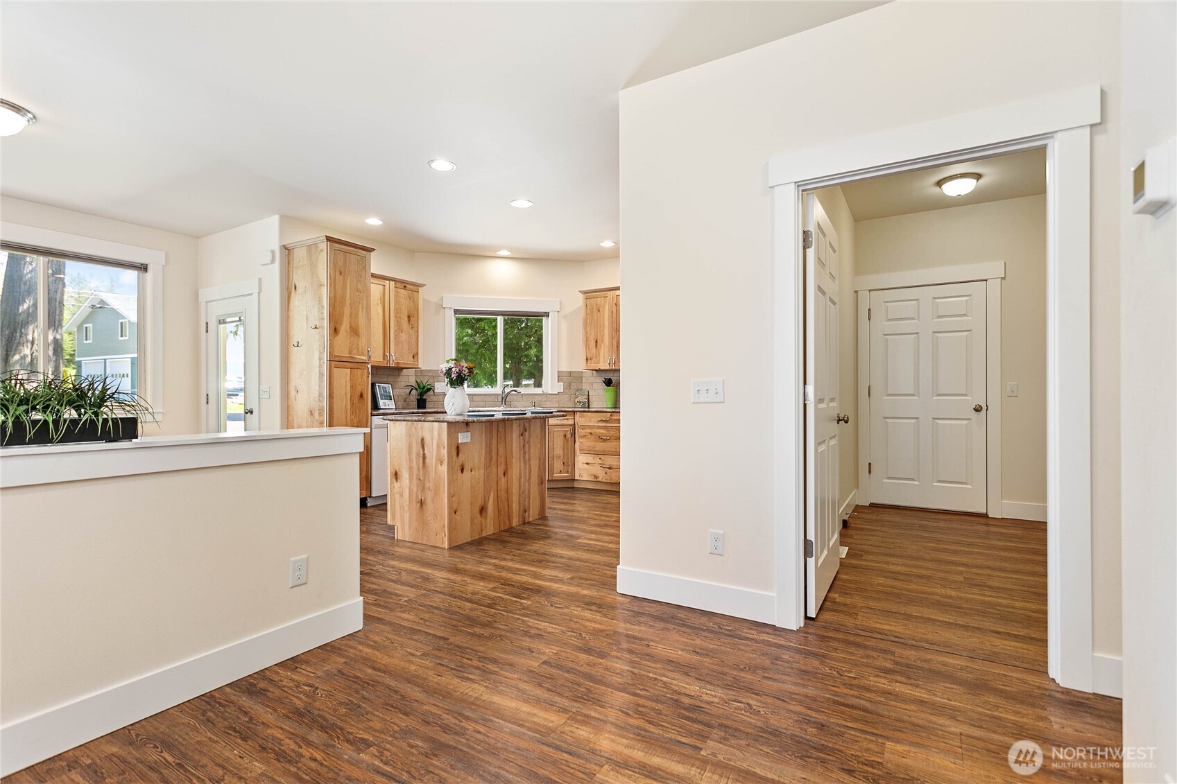 4597 Orcas Way Ferndale, WA 98248 - Photo 16 of 40 a kitchen with stainless steel appliances a refrigerator and wooden floor