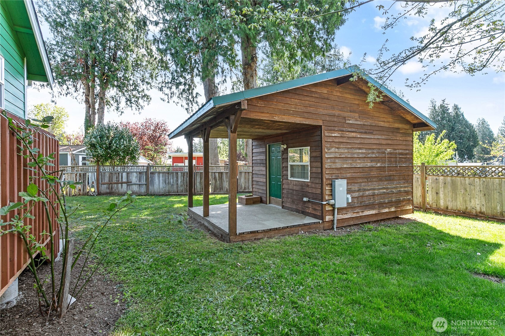 4597 Orcas Way Ferndale, WA 98248 - Photo 30 of 40 a view of a house with backyard and a tree